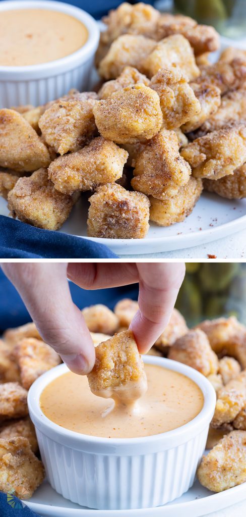 Crisp chicken nuggets are shown on a plate with sauce.
