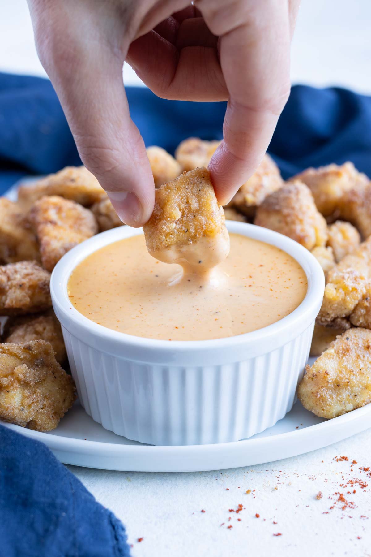 Copycat Chick-fil-A sauce is served with chicken nuggets.