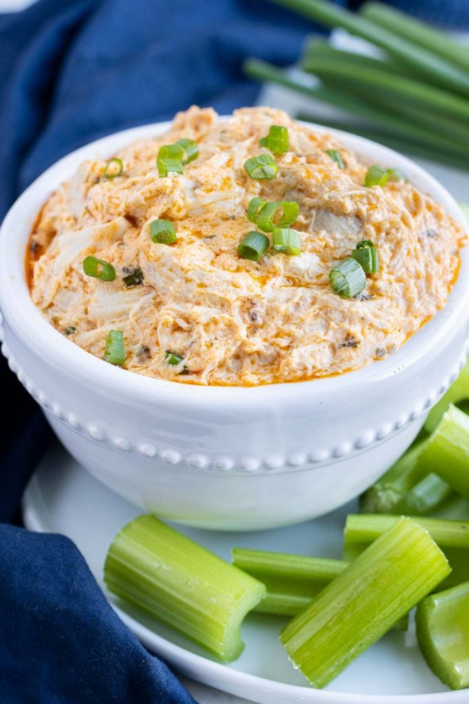 Low carb buffalo dip is served with celery.