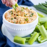 A plate of celery is served with the low-carb buffalo dip.