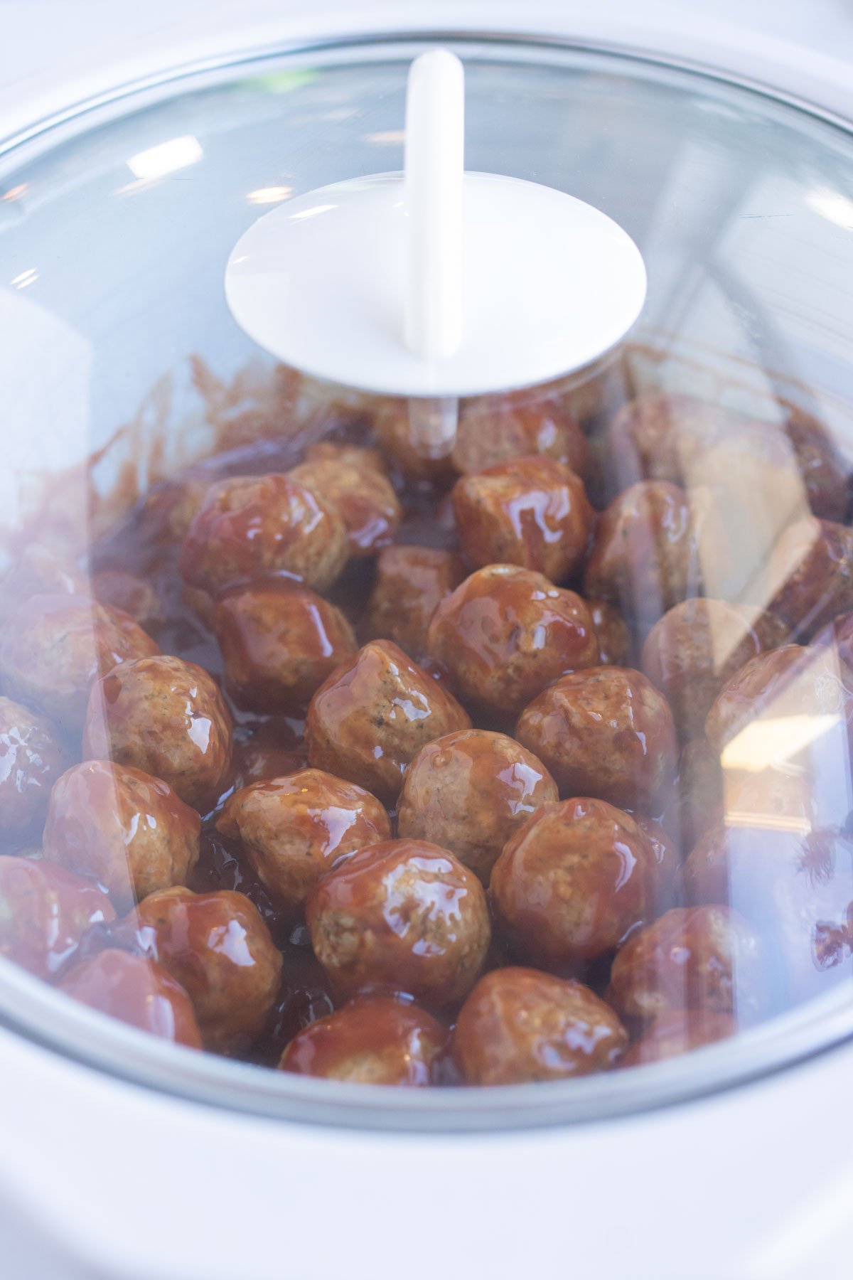 The slow cooker is covered and left to cook for 2 hours.