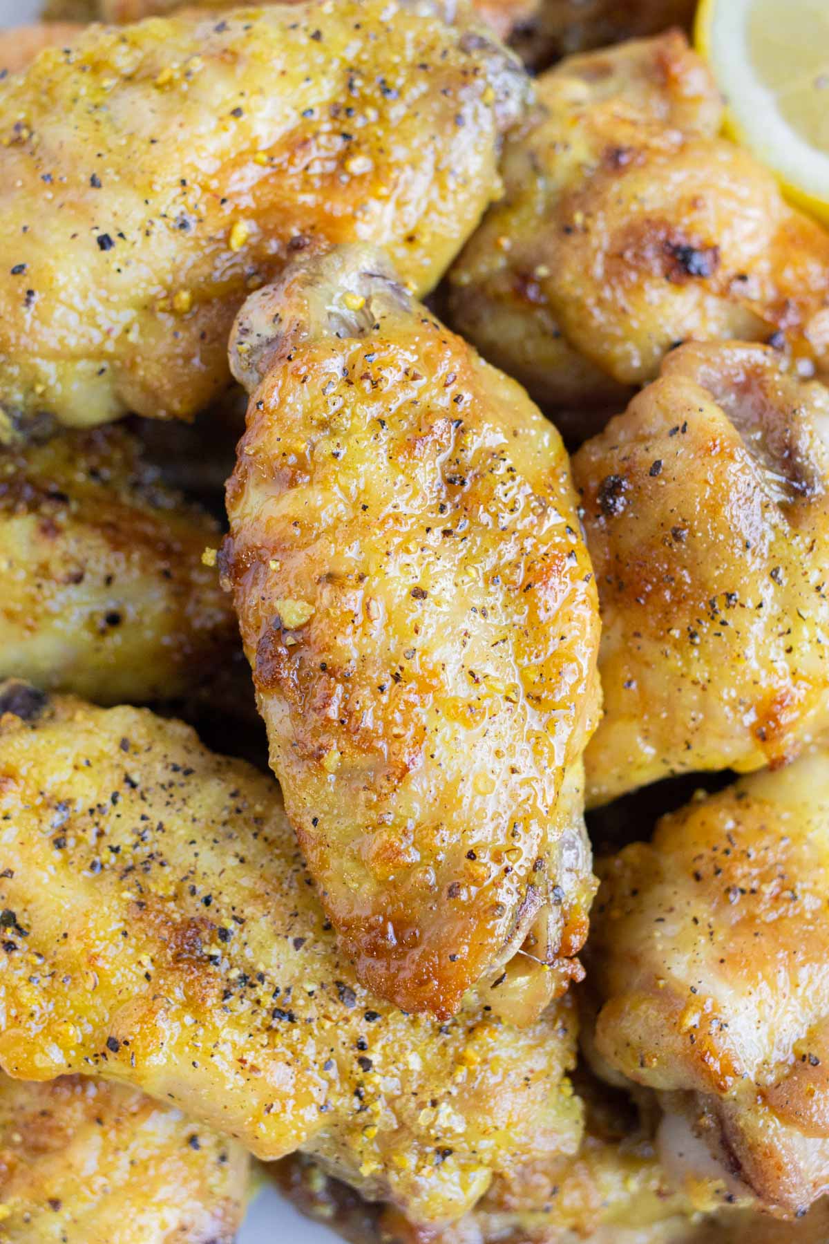 Crispy lemon pepper chicken wings are shown for an appetizer.