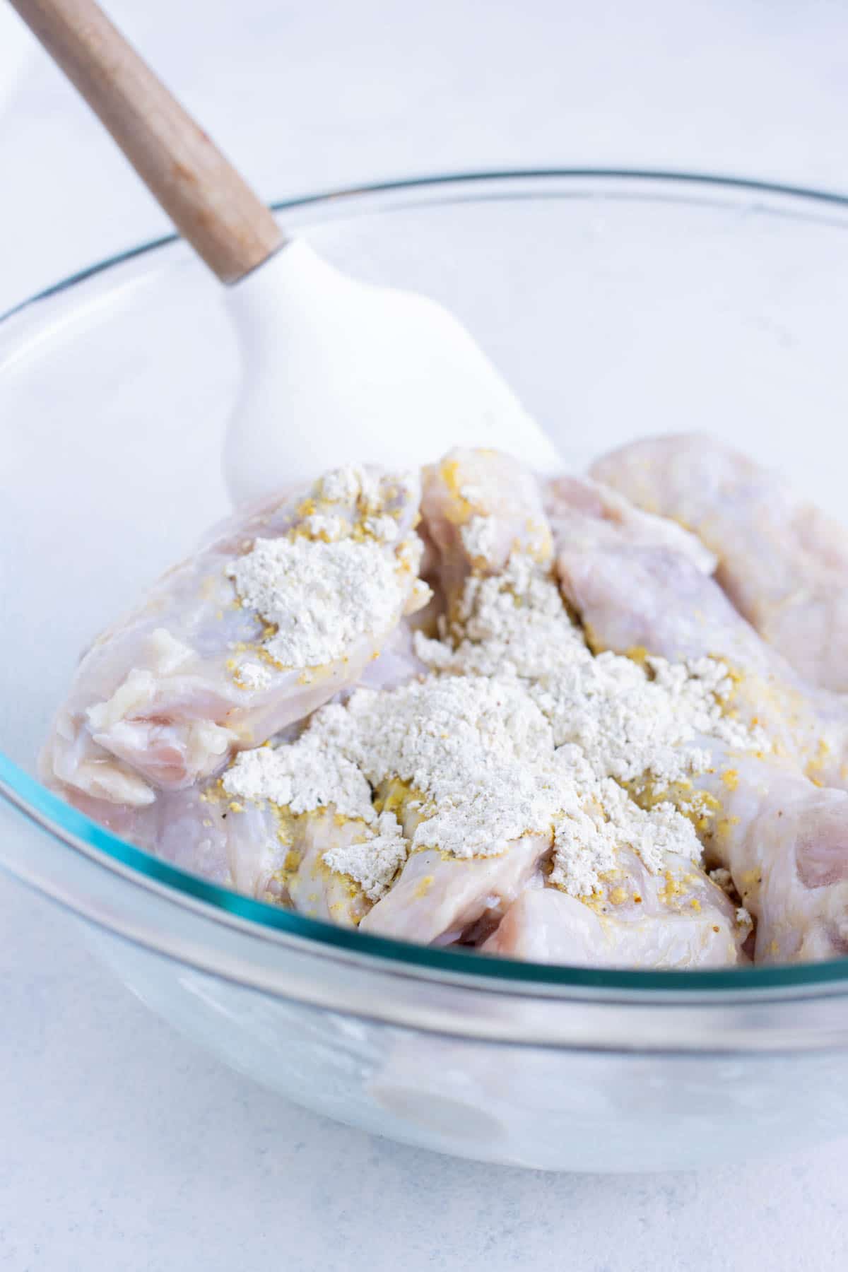 Lemon pepper seasonings and cornstarch are added to the wings.