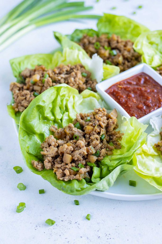 Copycat PF Chang's lettuce wraps are served on a white plate.