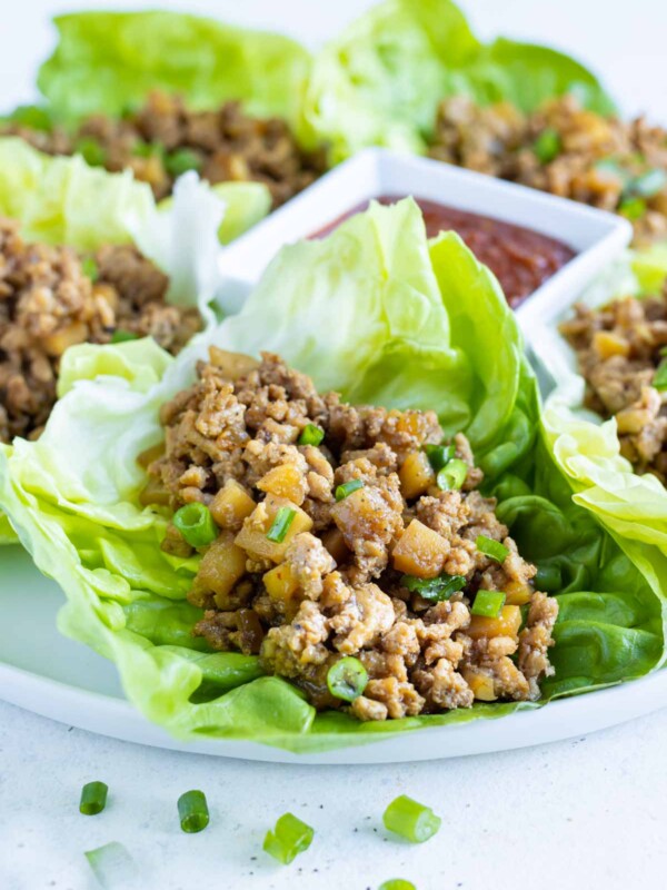 Butter lettuce leaves are filled with Asian ground chicken.
