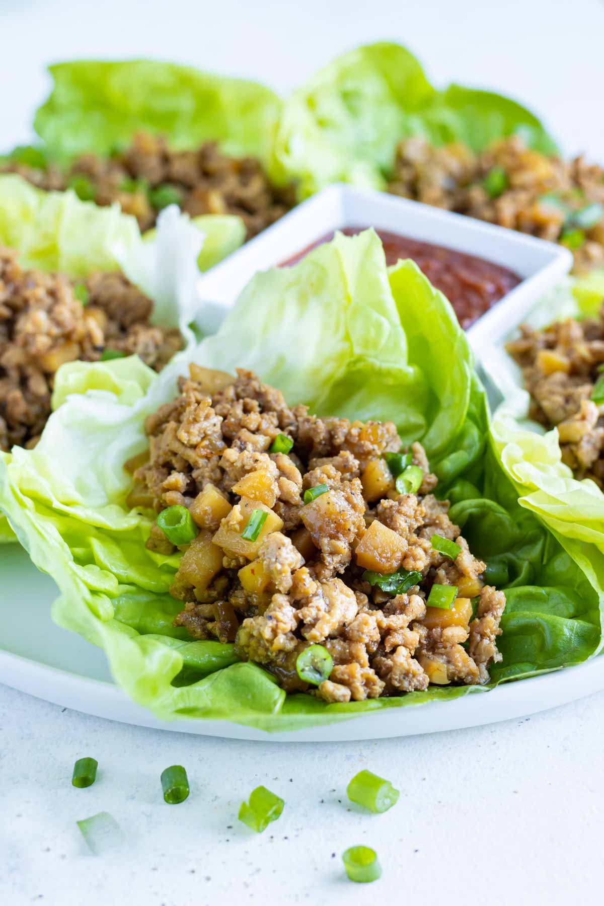 Butter lettuce leaves are filled with Asian ground chicken.