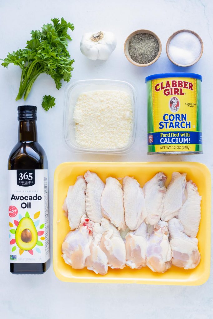 Chicken wings, oil, corn starch, salt, pepper, garlic, and parmesan are the ingredients in this recipe.