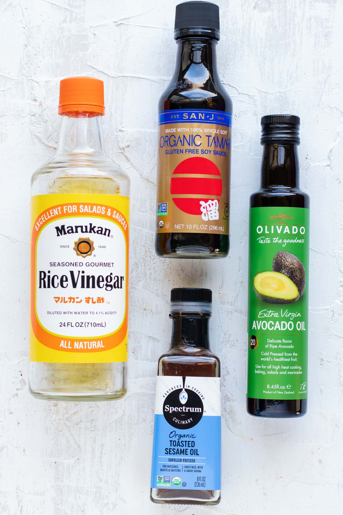 Rice wine vinegar, avocado oil, sesame oil, and gluten-free soy sauce as ingredients for a fried rice sauce.