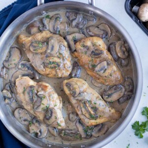 The best copycat Chicken Marsala is shown in a pan on the counter.