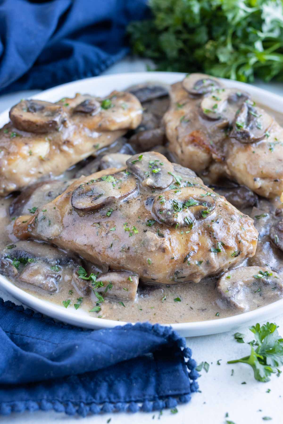 Mushroom Chicken Marsala is served on a plate for a copycat Olive Garden recipe.