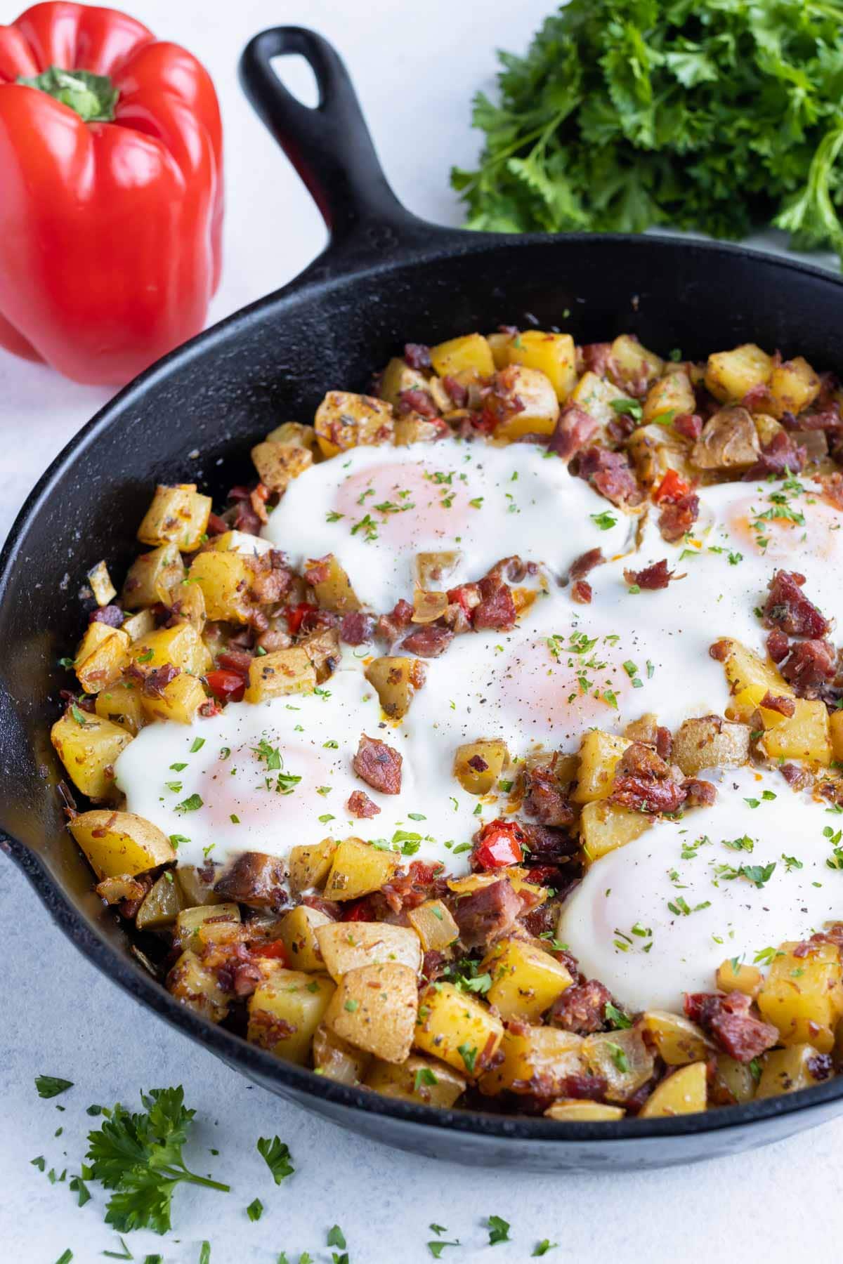 A cast-iron skillet is shown full of traditional corned beef hash.