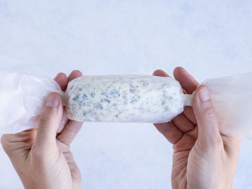 Garlic Herb Butter log is rolled up and kept in the fridge until using.