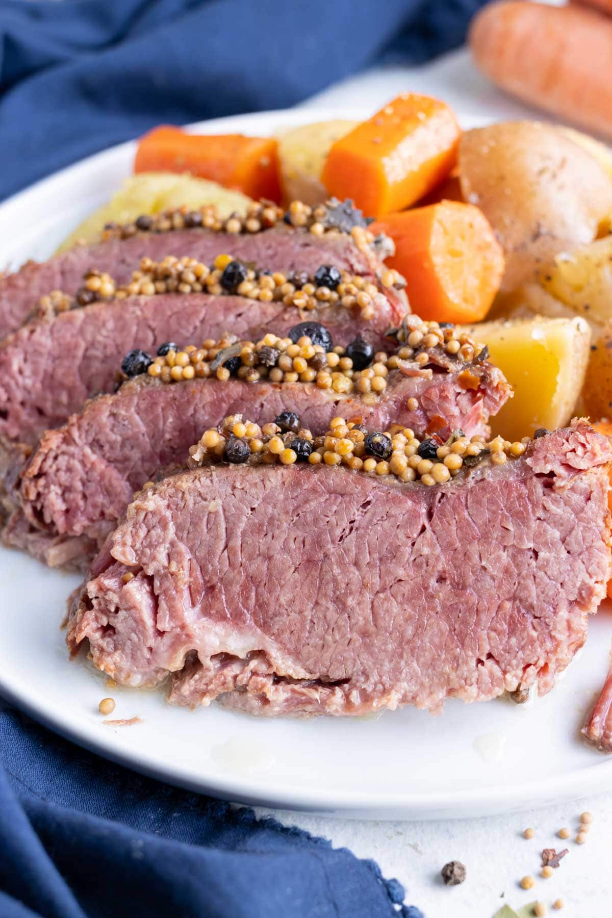 Irish corned beef and cabbage is served on a plate for dinner. 