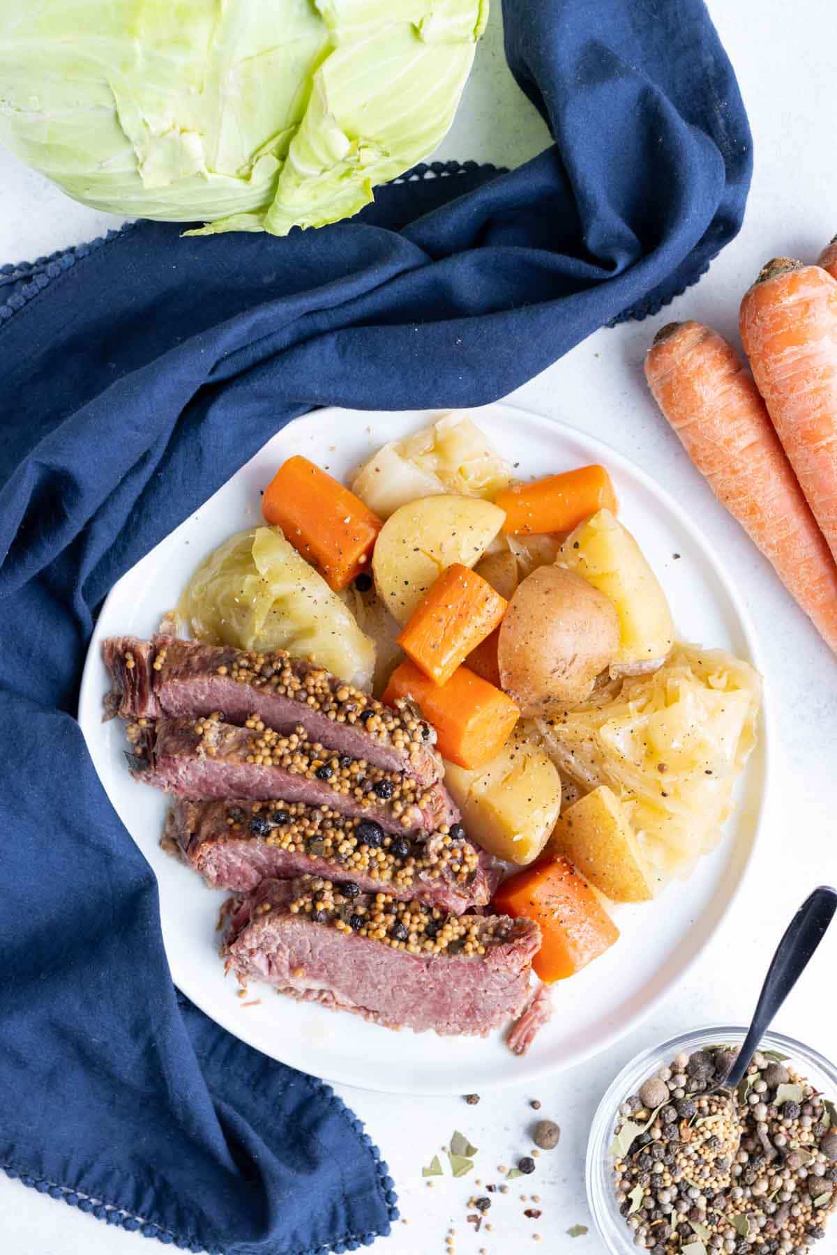 Potatoes, cabbage, and carrots are served with classic corned beef.