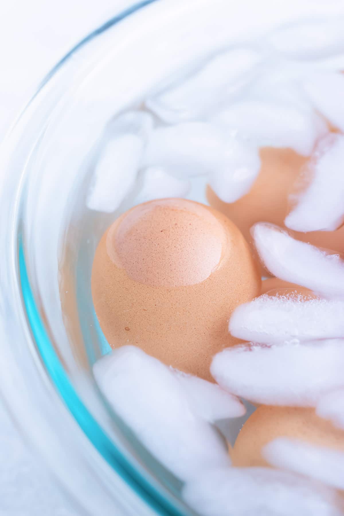 A picture of immersing hard-boiled eggs in an ice bath after cooking.