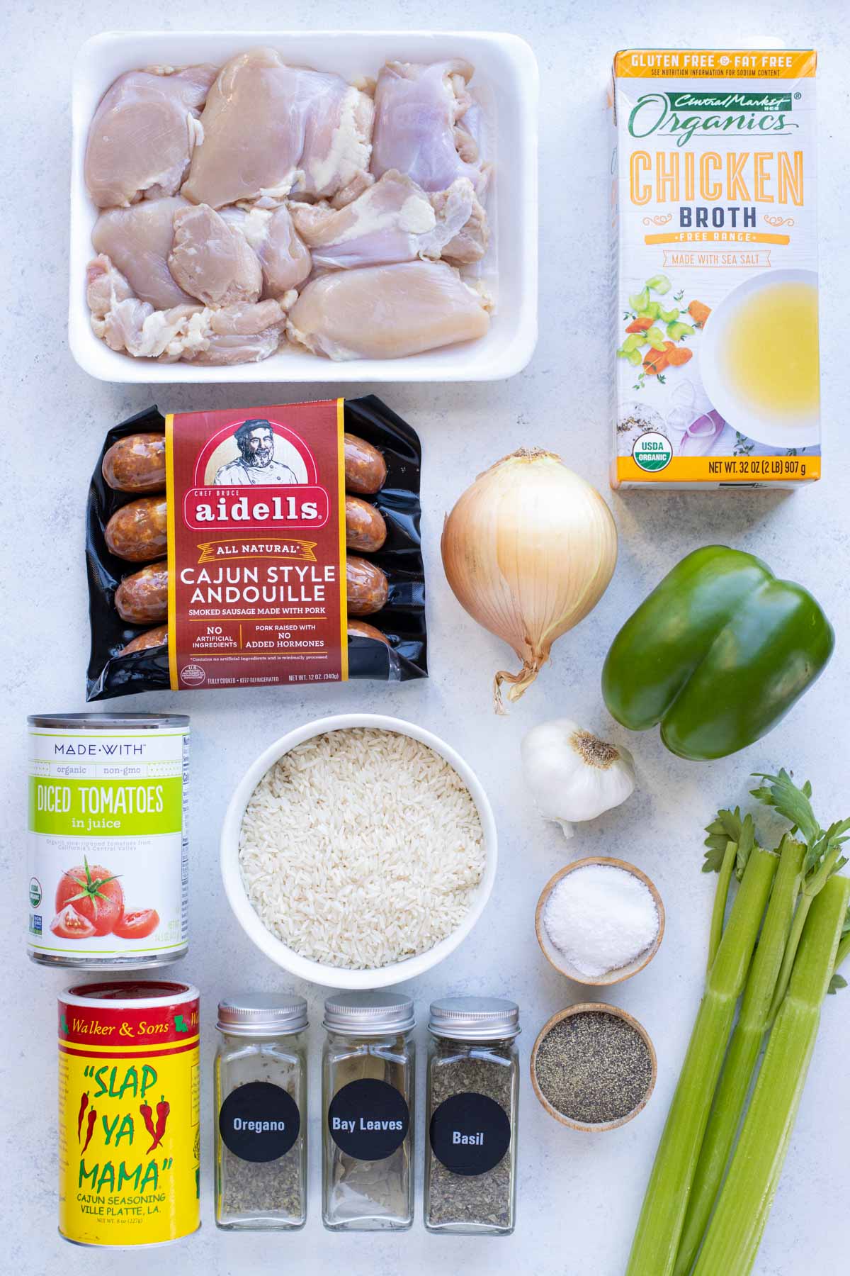 Chicken thighs, sausage, onions, peppers, celery, broth, rice, tomatoes, seasonings are the ingredients in this recipe.