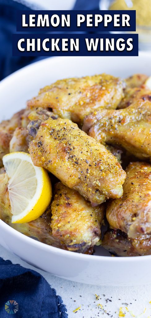 Oven-baked lemon pepper wings are served as a low-carb appetizer in a bowl.