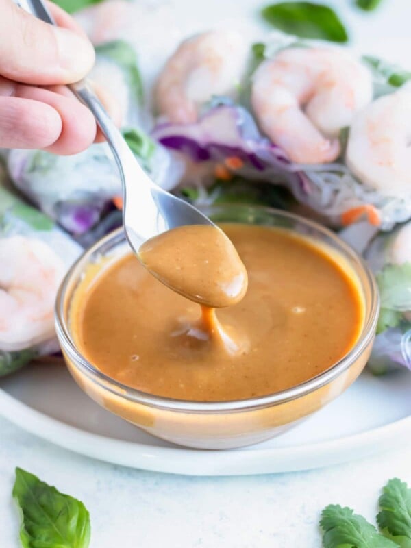 A spoon is used to serve this easy peanut sauce.