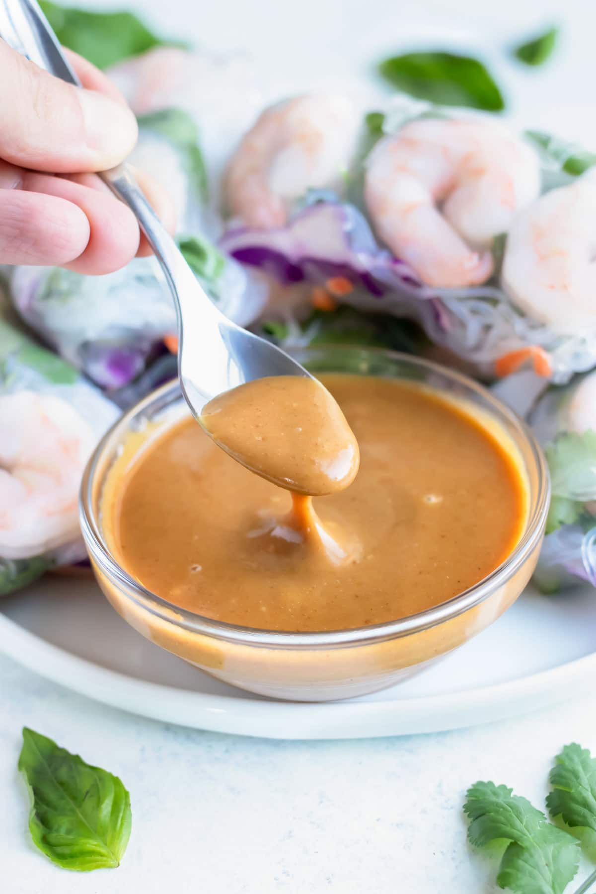 A spoon is used to serve this easy peanut sauce.