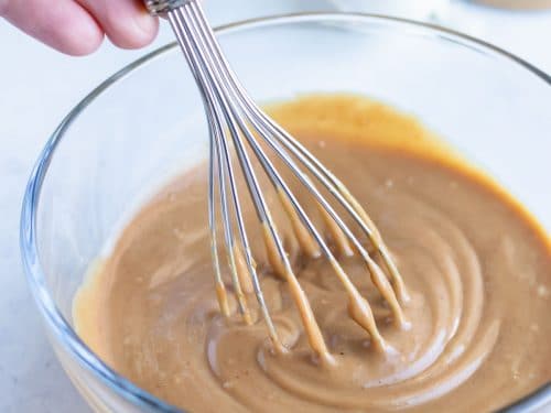 A whisk is used for mixing the ingredients into a smooth texture.