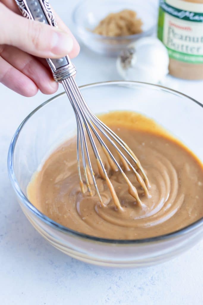 A whisk is used for mixing the ingredients into a smooth texture.