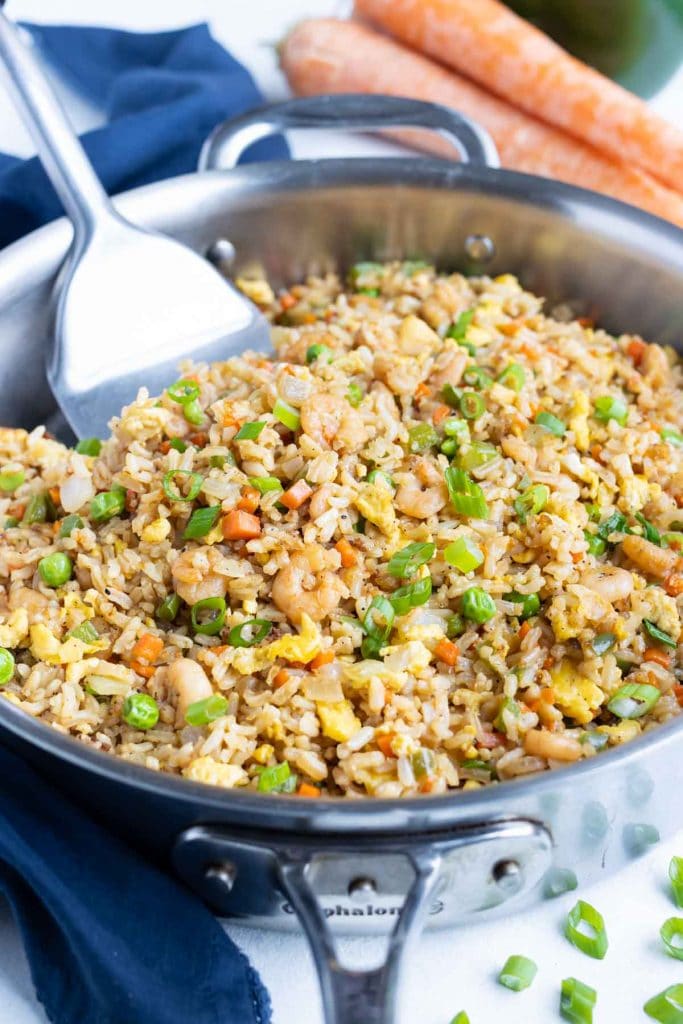 A skillet is filled with quick & easy shrimp fried rice.