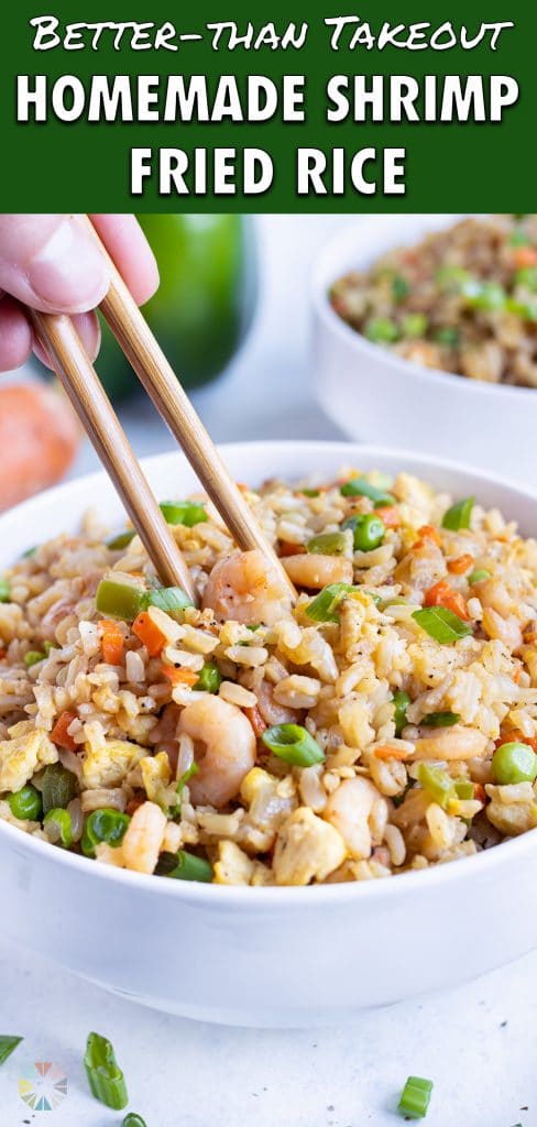 Two bowls are filled with delicious shrimp fried rice.