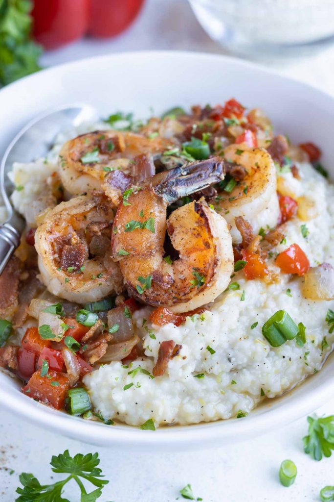 A bowl is filled with traditional Shrimp and Grits.