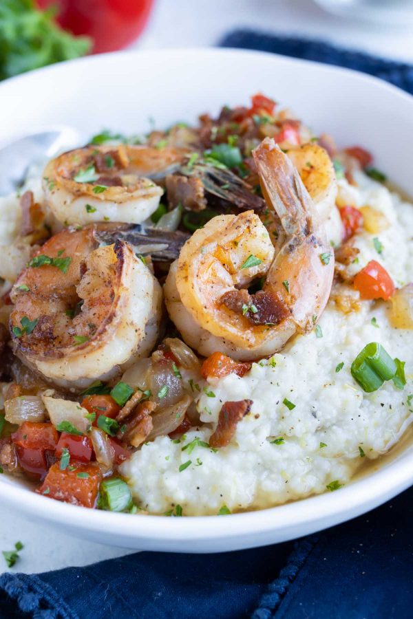 Creamy grits are served with cajun shrimp for this recipe.