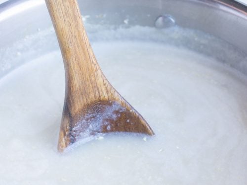Broth and milk are boiled on the stove.