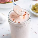 Tangy homemade dressing is served from a mason jar.