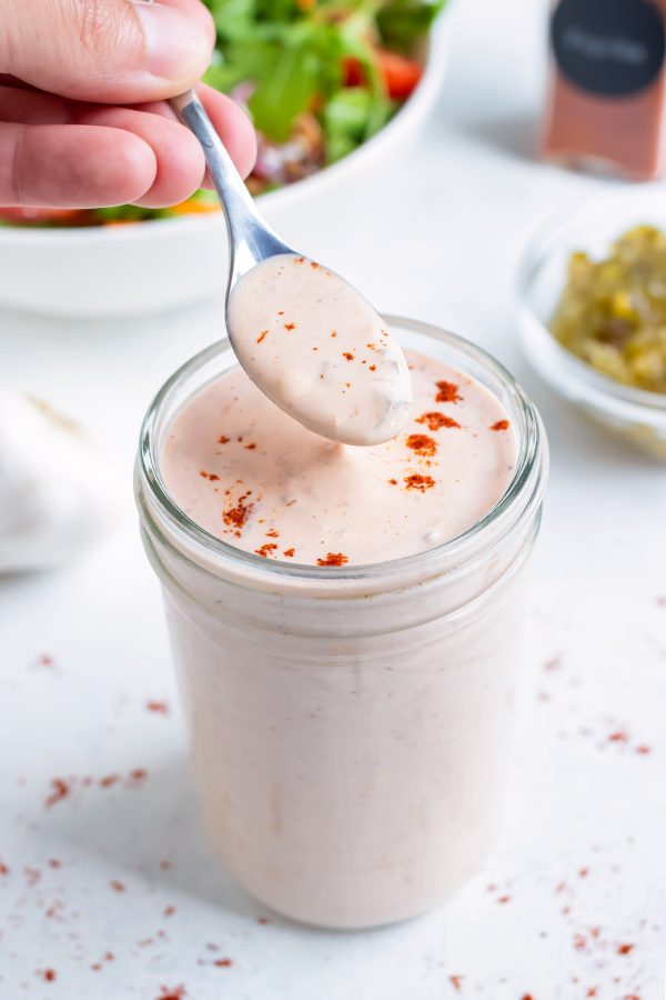 Tangy homemade dressing is served from a mason jar.