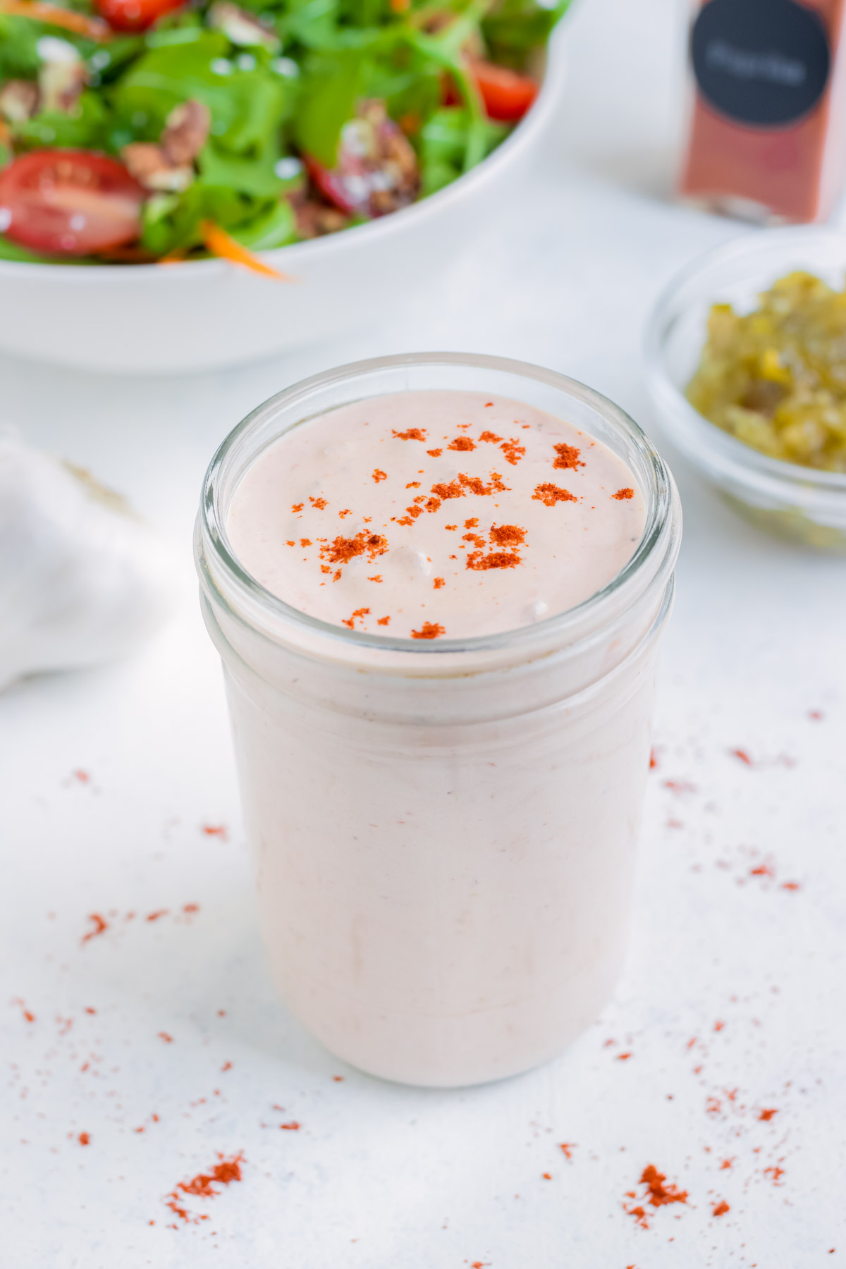 Homemade thousand island salad dressing is stored in a mason jar.