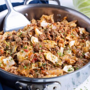 A skillet full of quick and easy cabbage rolls is shown on the counter.
