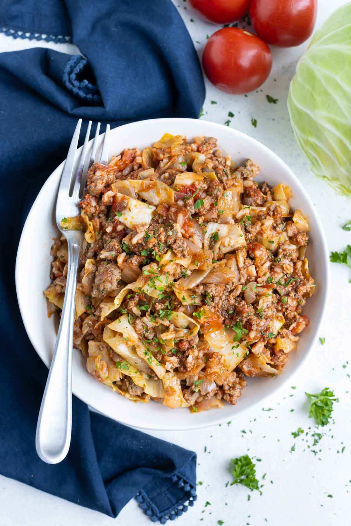 Deconstructed cabbage rolls are served in a bowl with a fork.