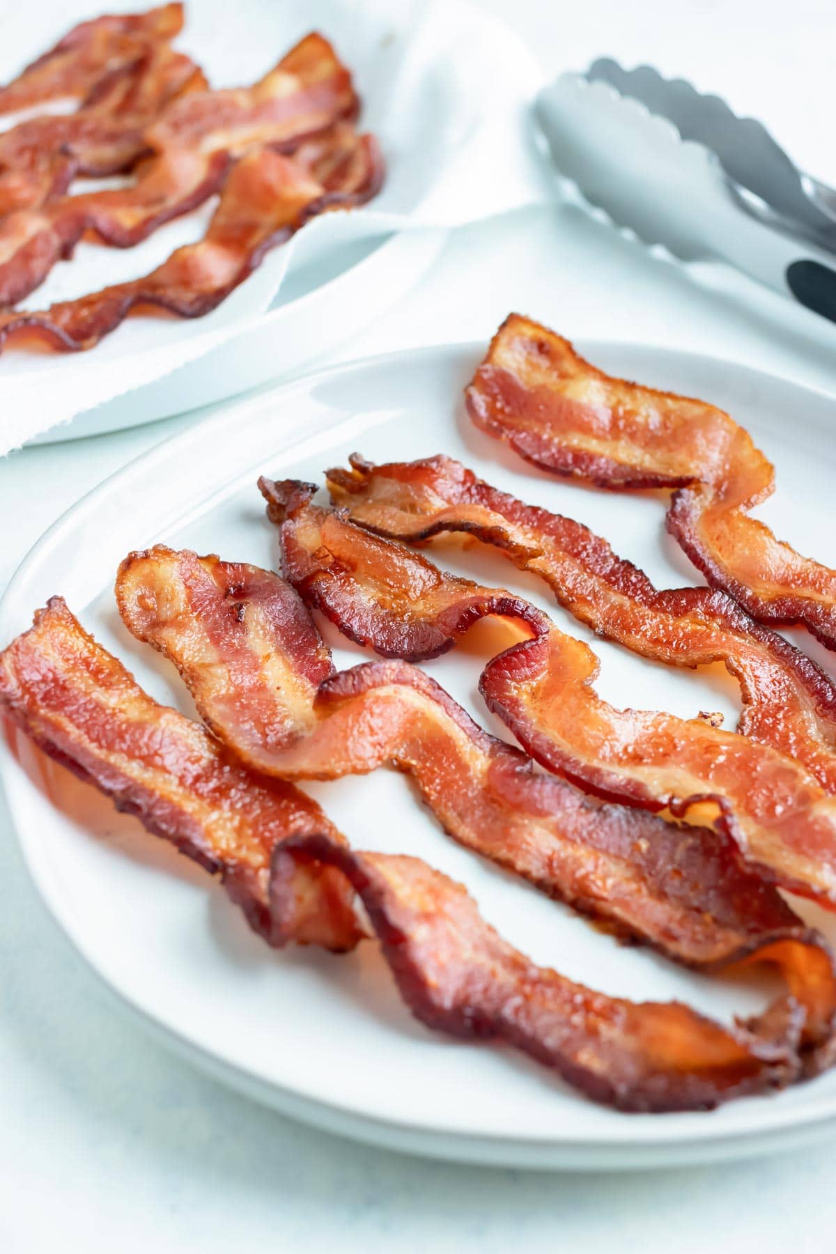 Extra crispy bacon is served on a plate.