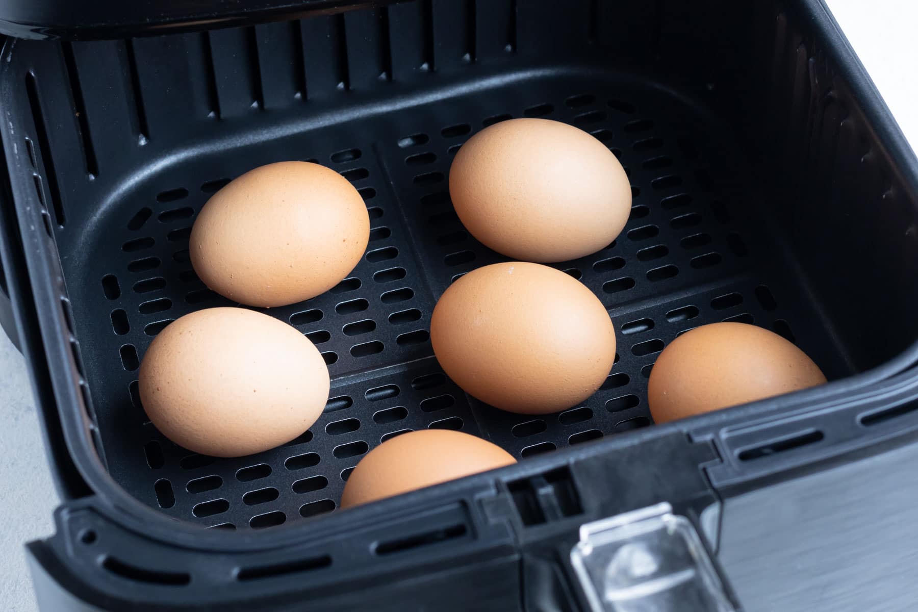 Preparing eggs in an air fryer