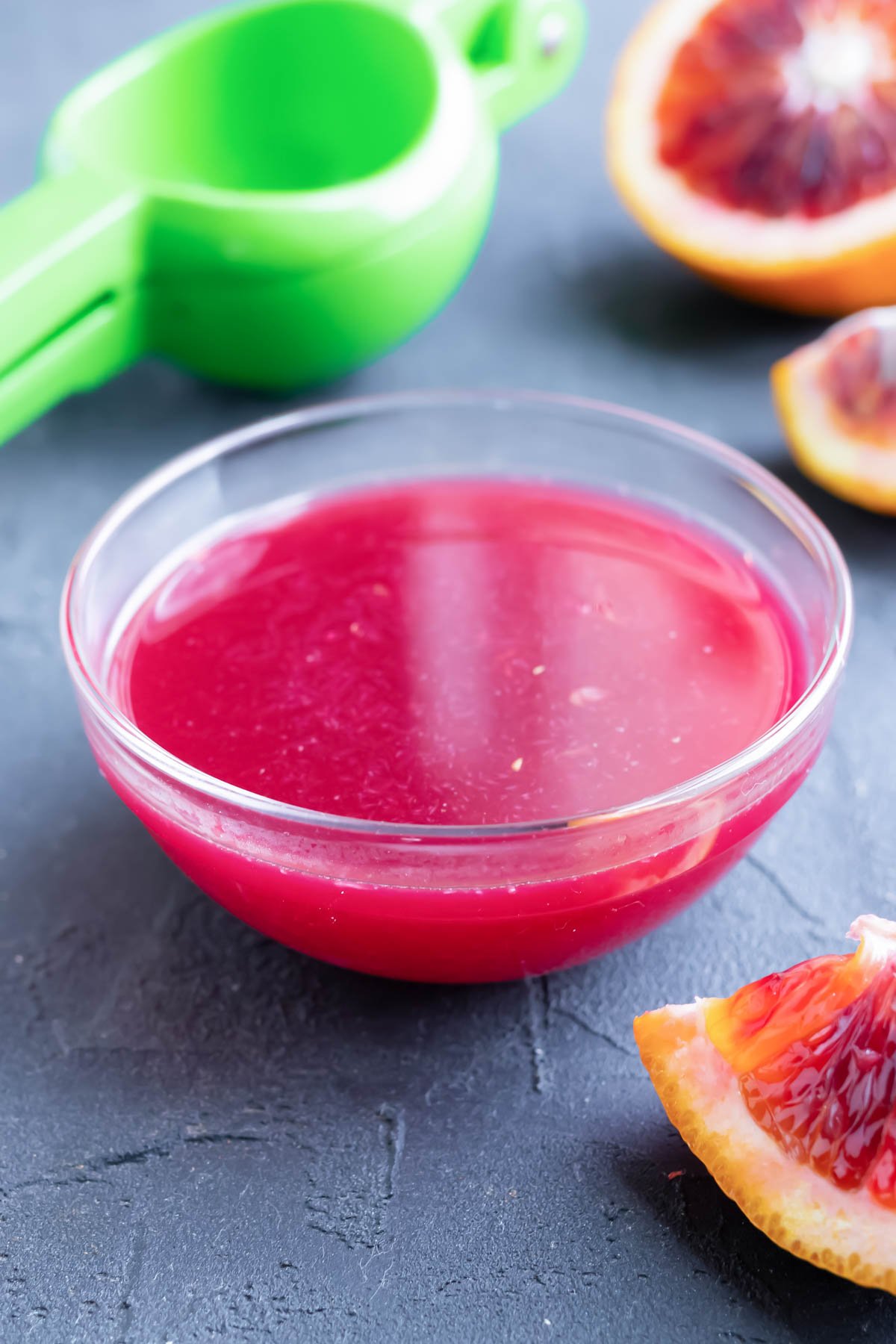 Blood orange juice in a clear bowl for last resort vinegar substitute.