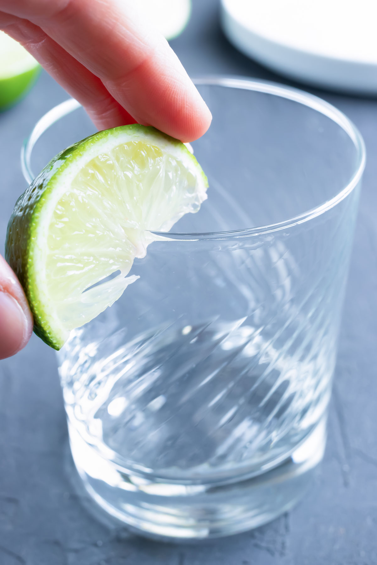 Use a lime wedge rubbed on the top of a glass to create a salted rim.