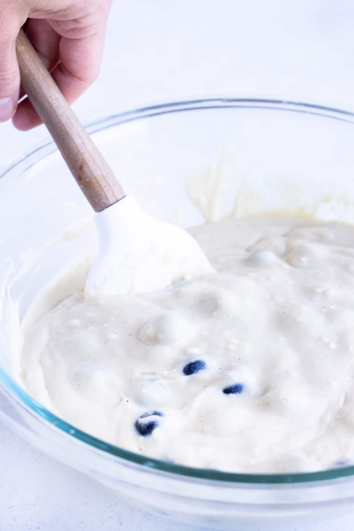 Blueberries are folded into the pancake batter.