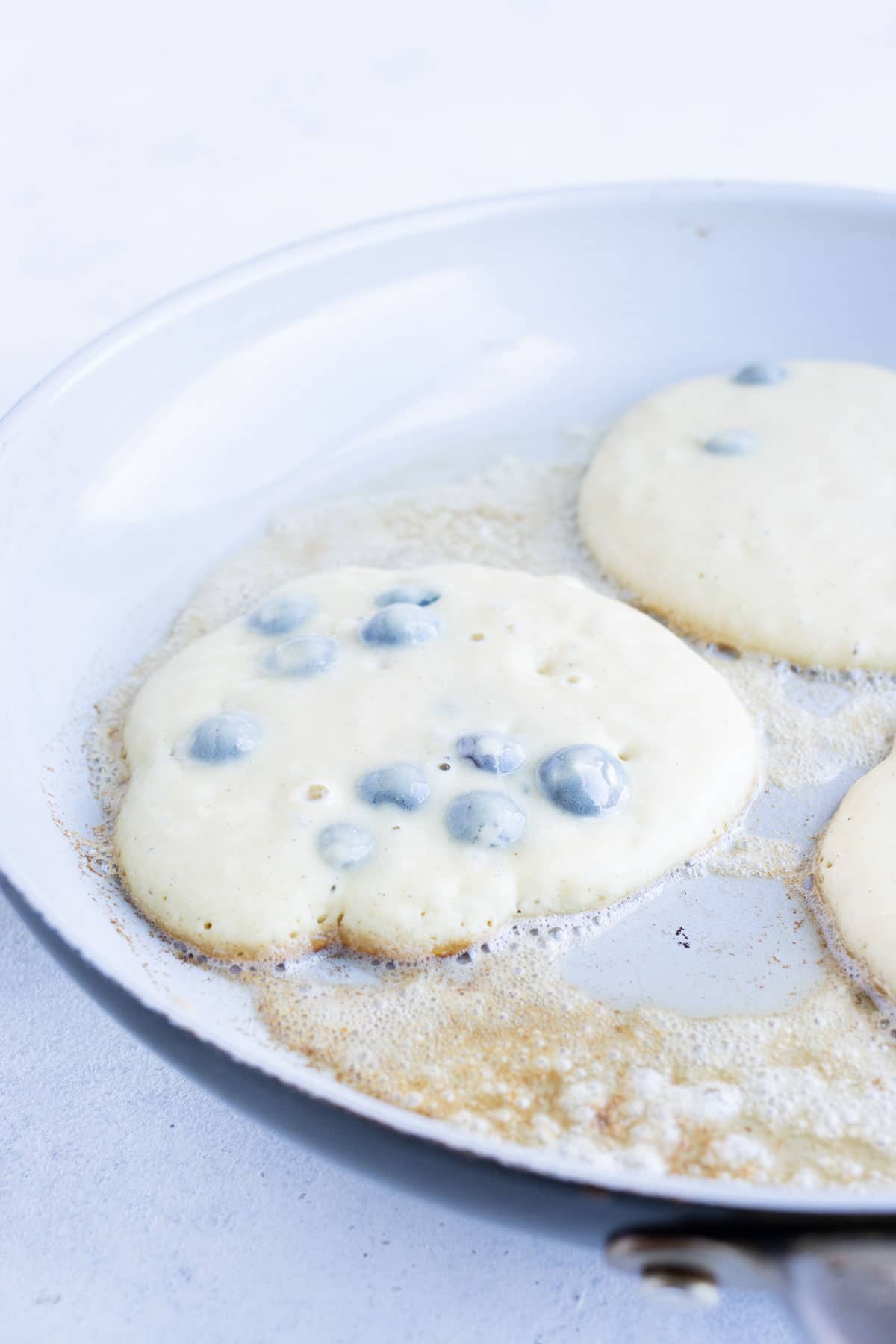 Pancakes are cooked on the stove.