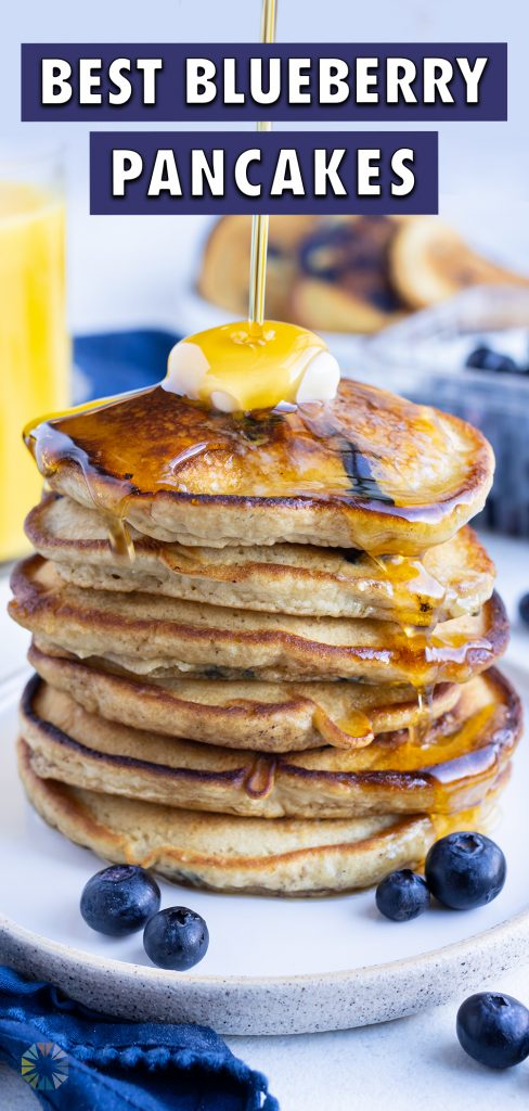 Syrup is poured on top of these fluffy gluten-free blueberry pancakes.