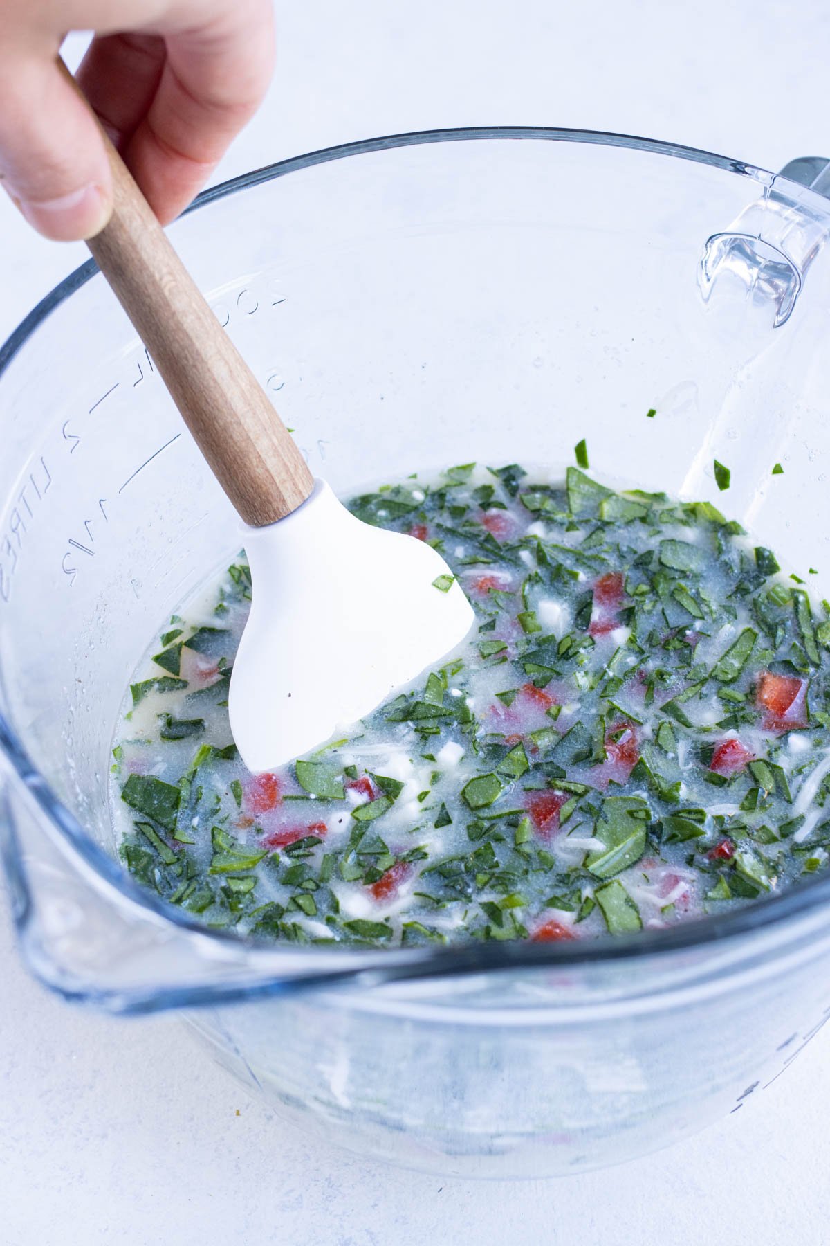  are folded into the egg whites with a spatula.
