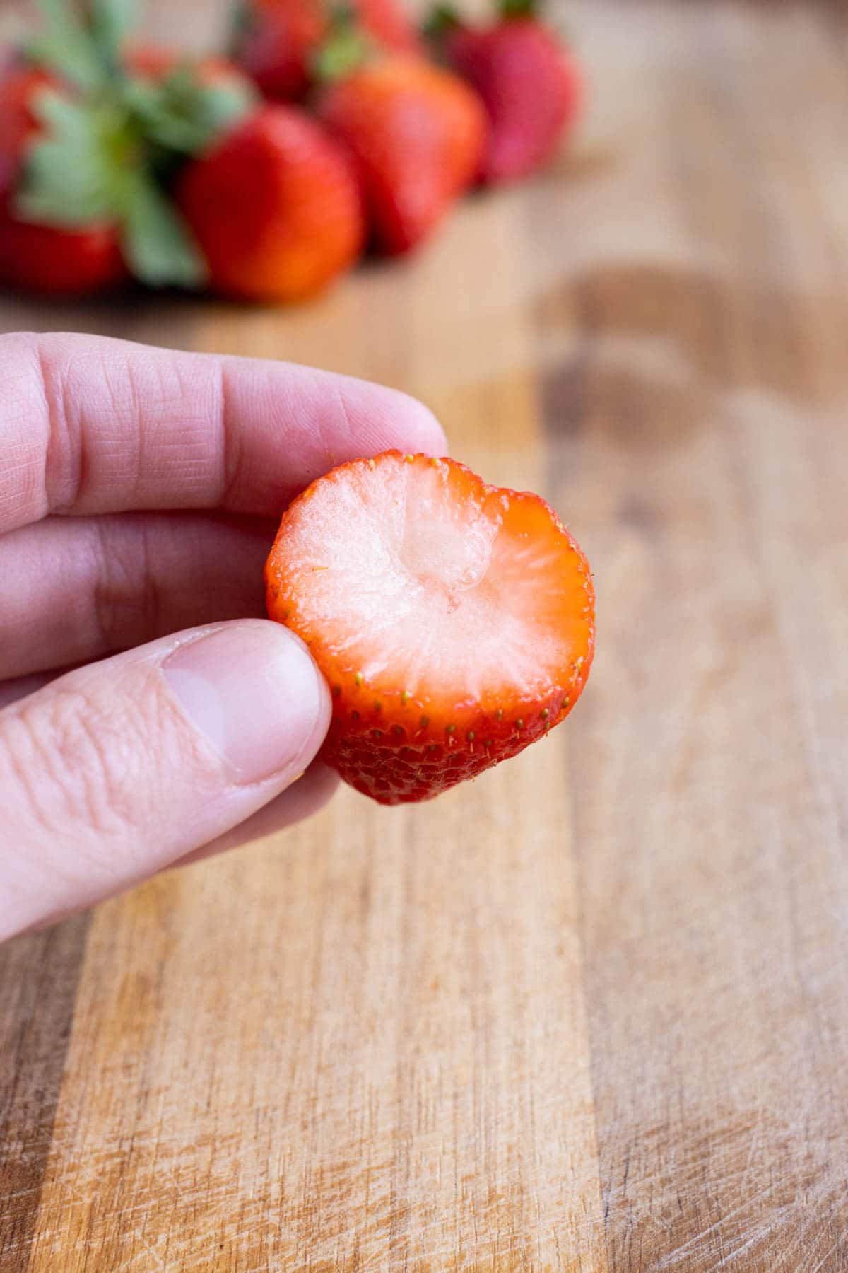 Stem is removed from the strawberry.