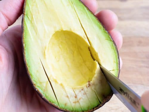 Use a knife to make small slices in the flesh of the avocado