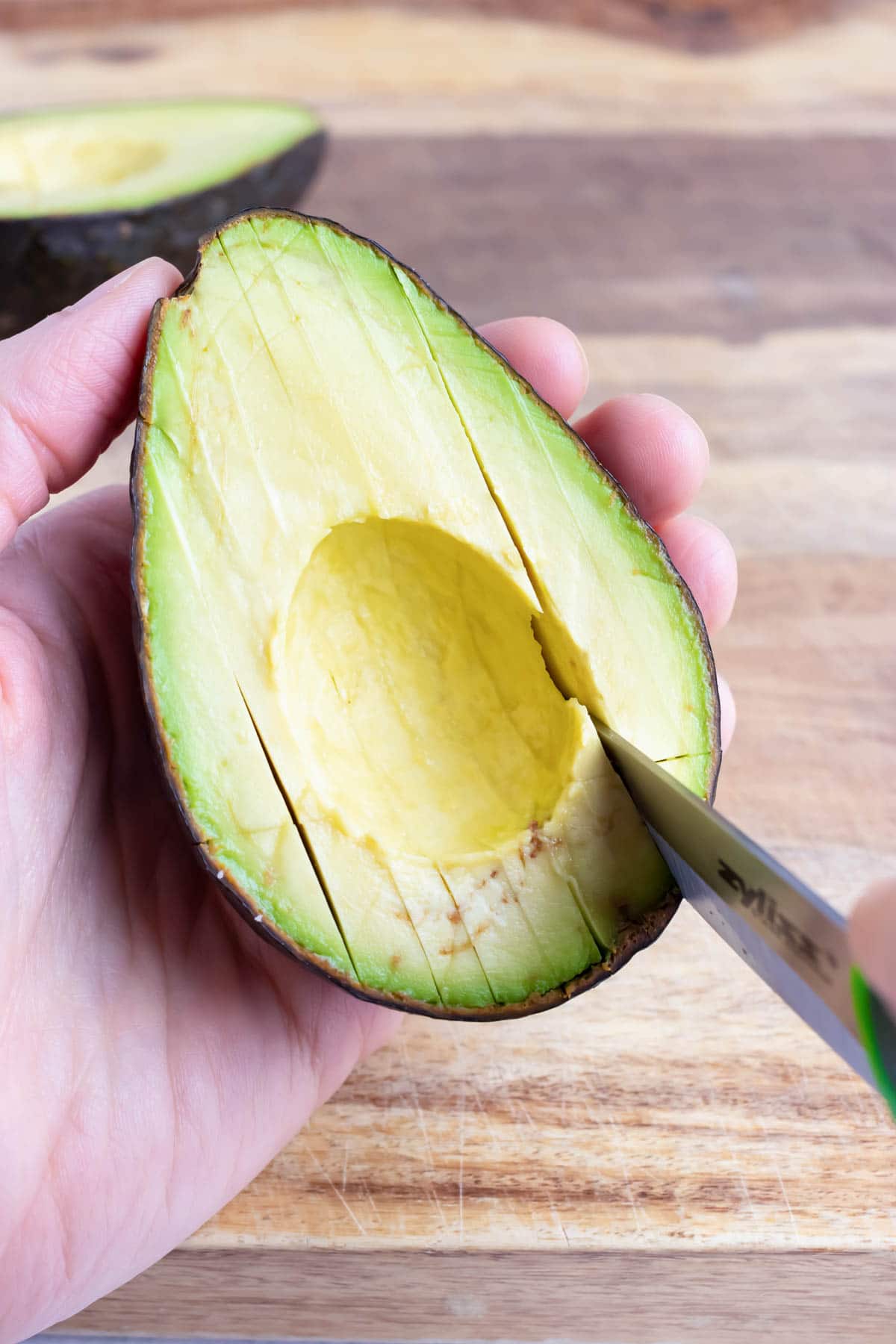 Use a knife to make small slices in the flesh of the avocado