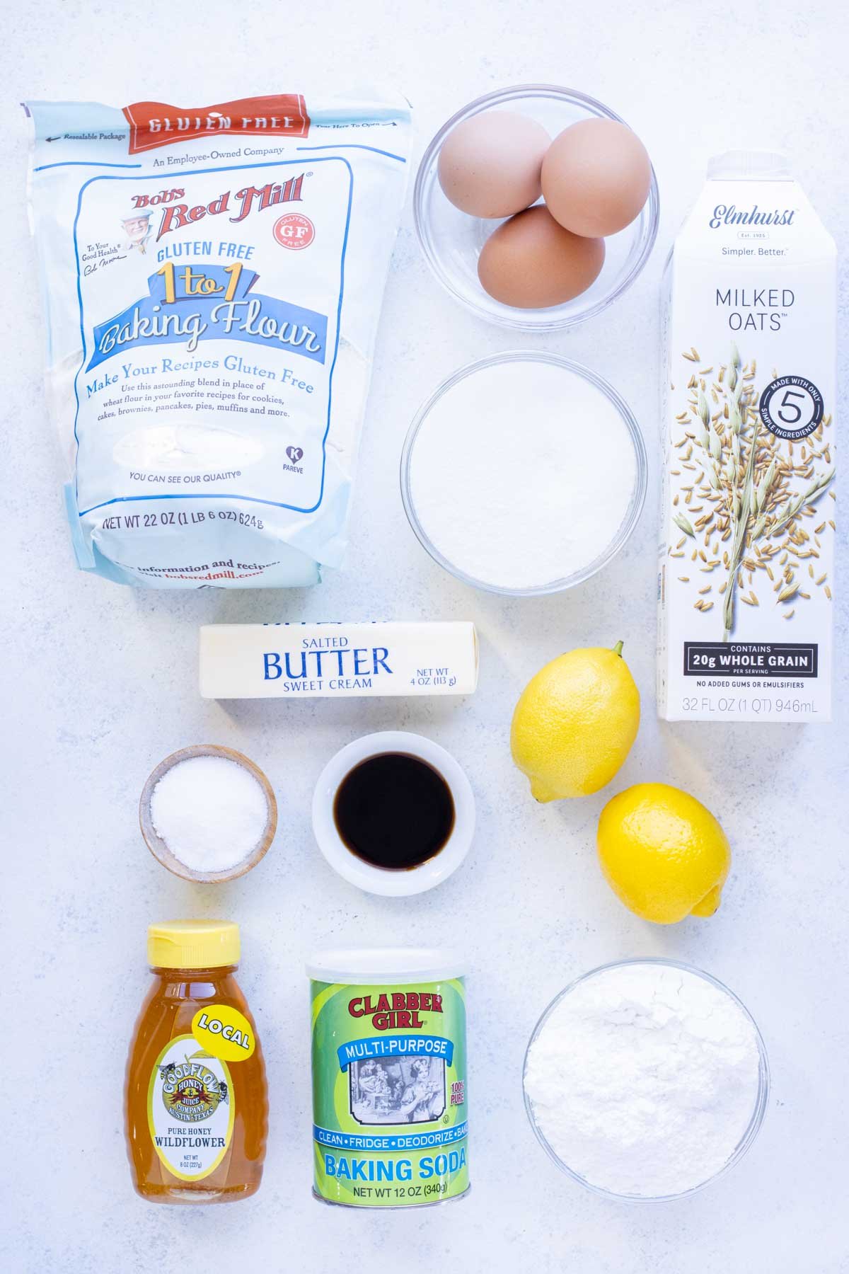 Flour, lemons, sugar, honey, milk, butter, eggs, powdered sugar, baking powder, and salt are the ingredients for this bread.