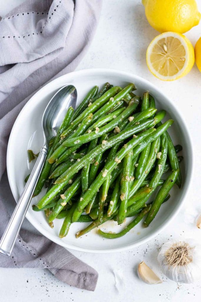 Easy sautéed green beans are served for a low-carb and healthy side dish.