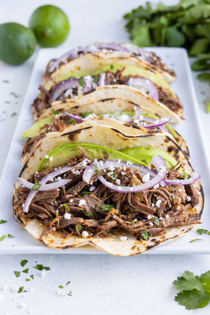 Tacos are served on a plate for dinner.