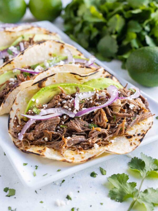 Tortillas are loaded with tender beef barbacoa and served.